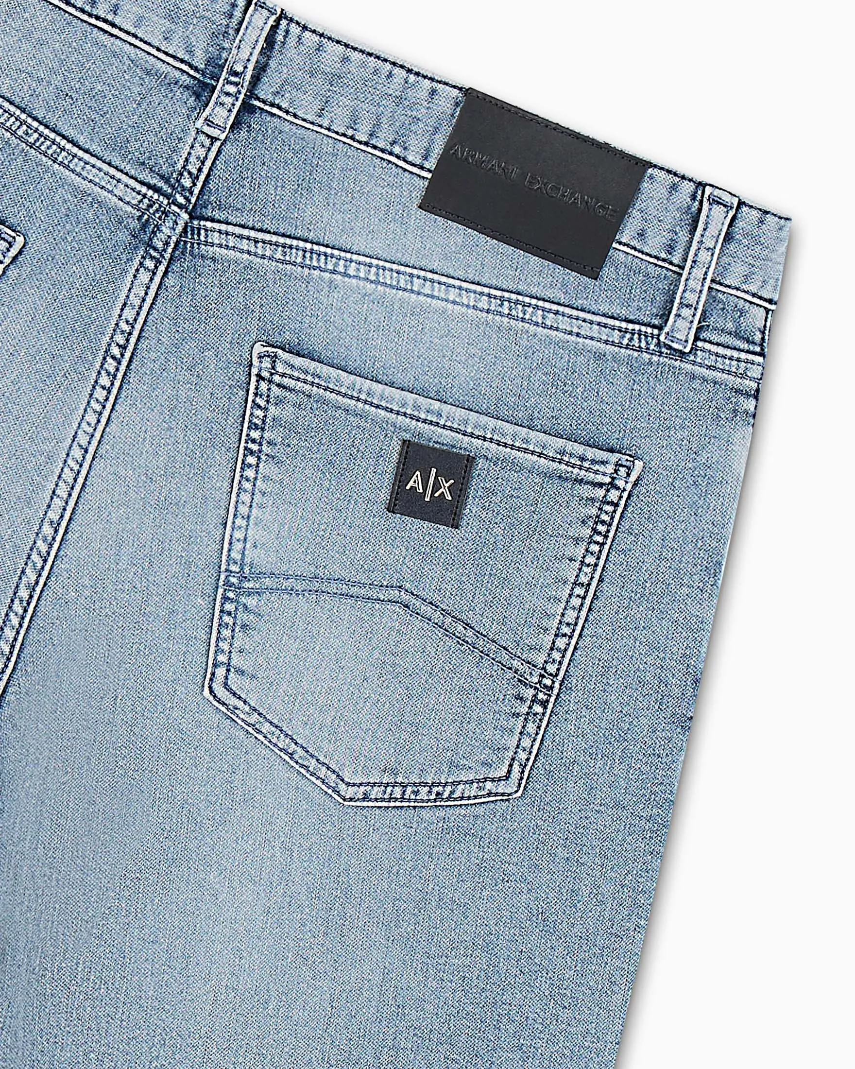 Jeans slim-fit a vita media in cotone stretch lavaggio chiaro super stone washed con baffature